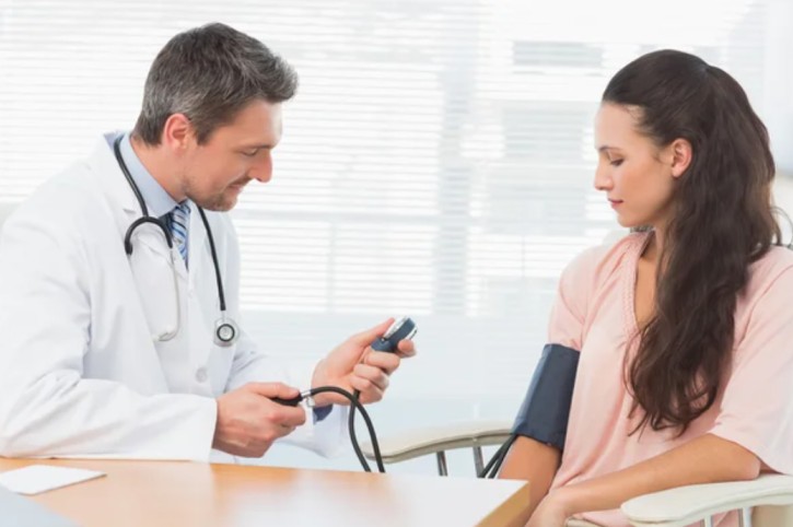 Doctor consulting a patient about blood balance